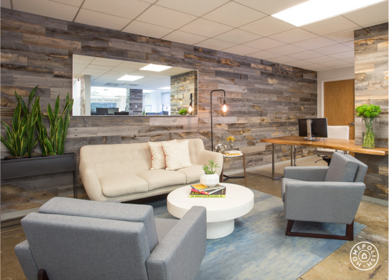 Reception seating against varied wood plank walls