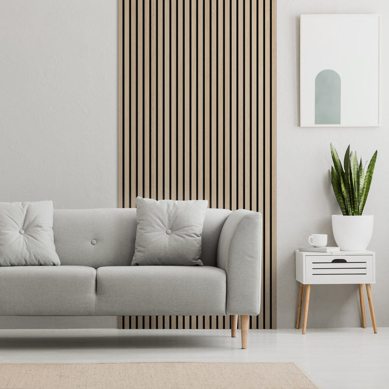 Gray sofa beside a narrow vertical wood slat accent