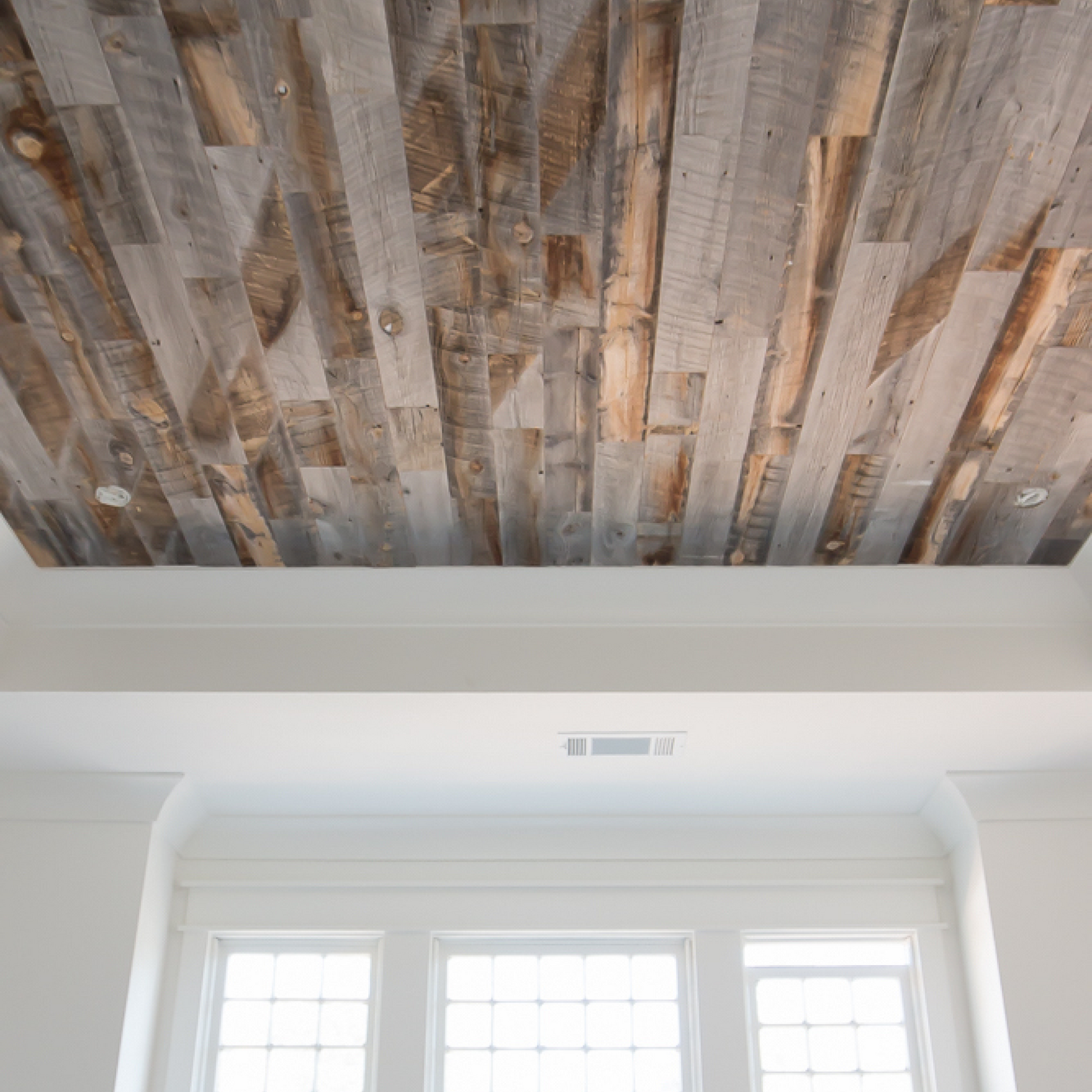 Stikwood real wood ceiling planks adding warm texture overhead