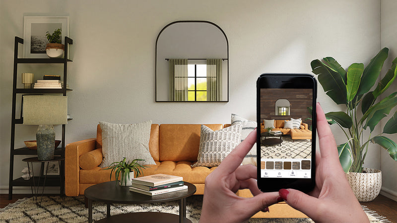 Person using a phone to preview a room design