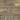 Close-up of Elements Reclaimed Prairie brushed wood planks with golden-brown, tan, and soft-gray variation
