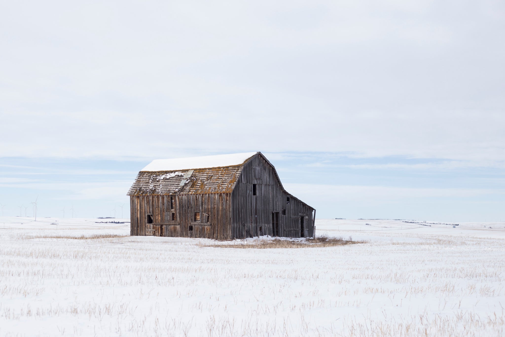 Old barn in snow covered plains