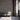 Waiting area with gray Cobblestone Stikwood planks and three chairs