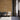 Waiting room with Golden Oak wood wall planks behind three gray chairs