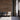 Reclaimed Sierra Silver planks on a wall behind three chairs and an open doorway