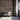 Reclaimed Weathered Wood planks on a wall behind three chairs in a waiting area