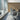 Conference room with Sienna Engineered Wood Wall Planks behind a table and chairs