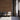 Vertical Grain Arabica planks on a wall behind three chairs and an open doorway