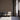 Vertical Grain Rustic Slate planks on a wall behind three gray armchairs