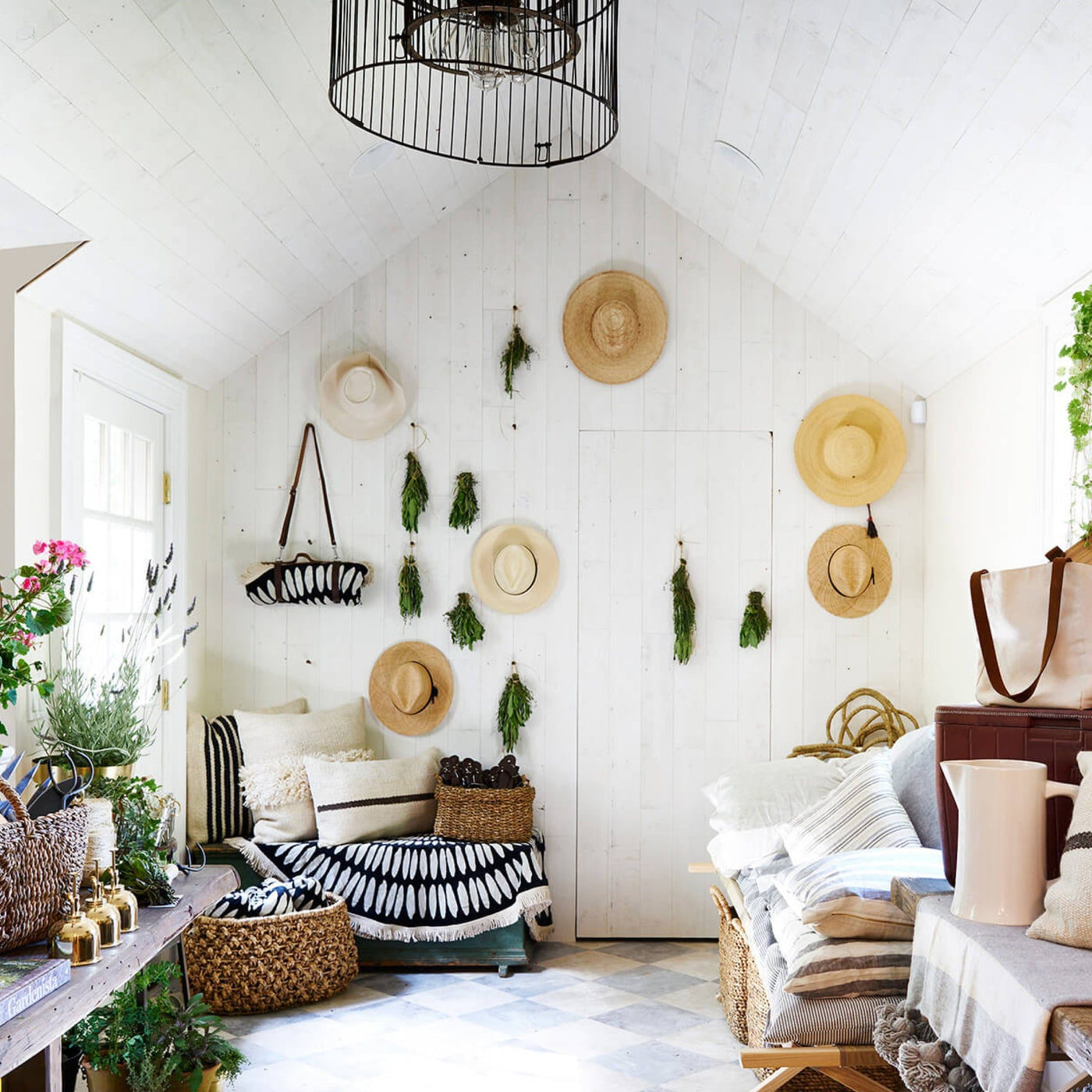 Bright room with Hamptons Peel & Stick planks, decorated with hats and greenery