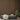 Aged Oak Slatwood wall behind two ottomans, books, a blanket, and a potted plant