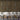 Reclaimed Sierra Silver Slatwood Chorus Acoustic Slat Panels behind a sofa and stools