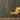Reclaimed Weathered Wood Slatwood Chorus Acoustic Slat Panels behind a yellow chair