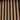 Close-up of Aged Oak Slatwood Melody Acoustic Wall Panels, alternating wood and black felt