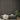 Driftwood Slatwood Acoustic Slat Panels behind two ottomans and a potted plant