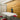 Office space with Golden Oak planks on the wall, table and chairs in the foreground