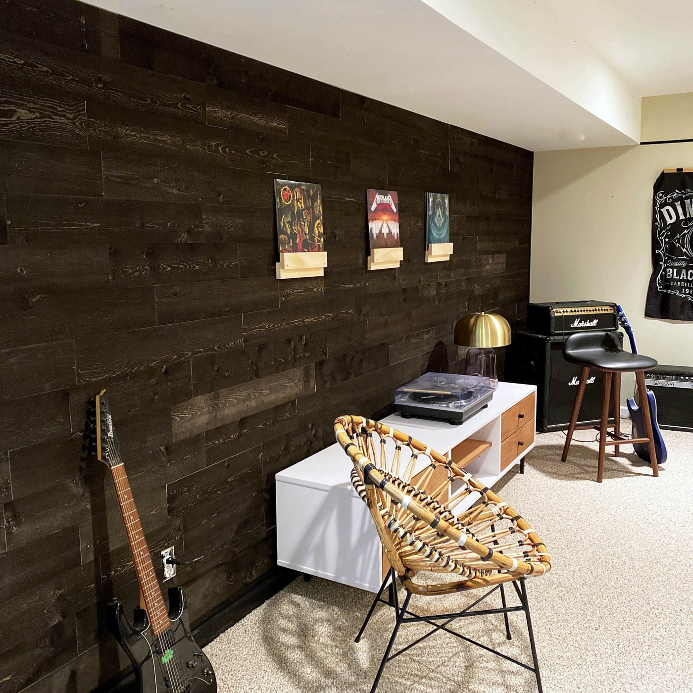 Onyx planks accent a music room with records, guitar, amp, and stool