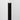 Onyx Peel & Stick Wood Corner Trim Sample in a corner, dark wood grain visible