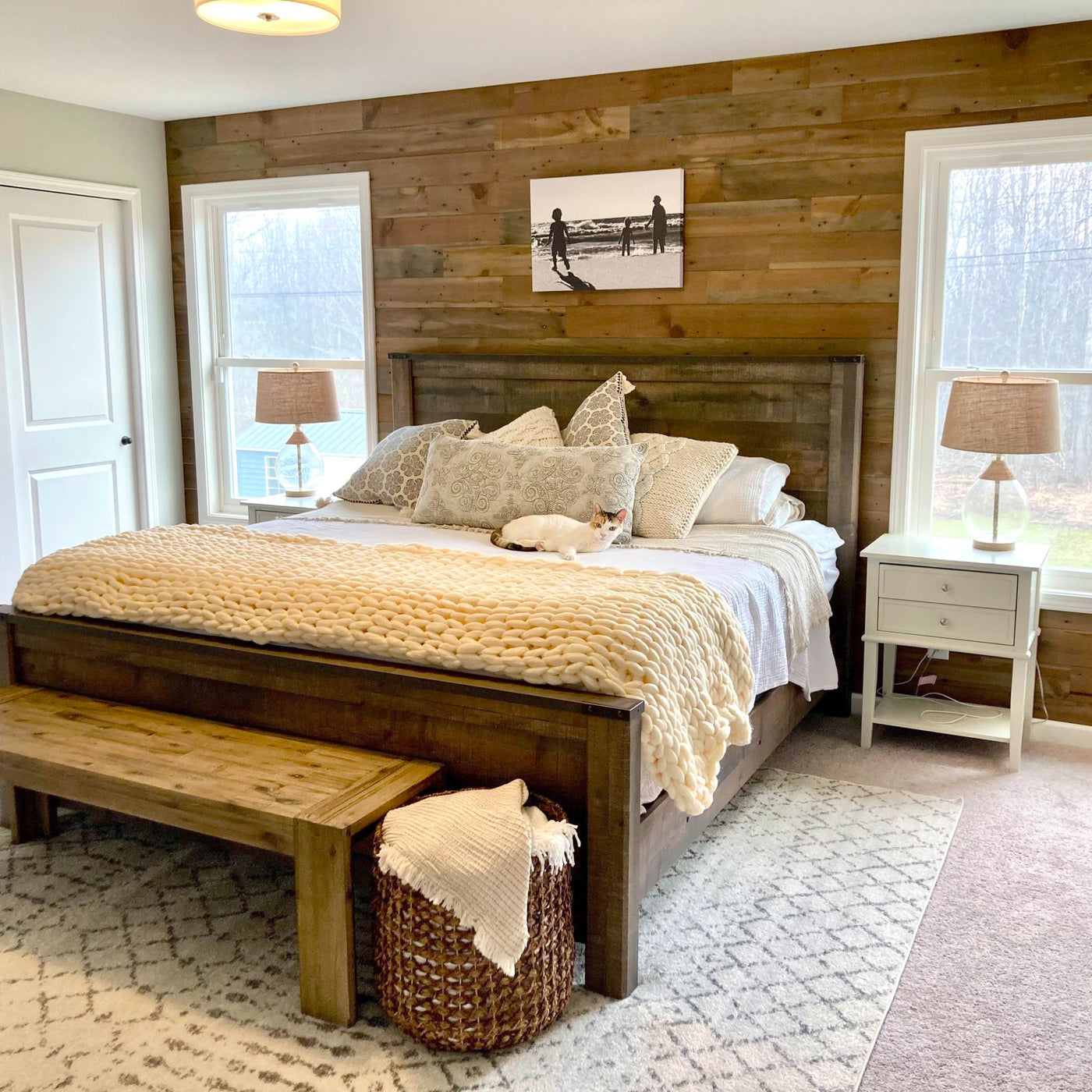Bedroom with Reclaimed Arabica Stikwood planks on the wall behind the bed