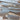 Reclaimed wood planks in gray and warm brown tones arranged to show texture and color variation
