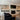 Reclaimed Weathered Wood Gray planks on built-in shelves flanking a fireplace
