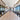 Modern conference room with Stikwood reclaimed weathered wood gray planks lining upper walls and ceiling beams
