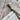 Overlapping gray weathered wood planks showing natural grain texture and knots