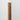 Redwood Grove corner trim sample on a white wall