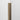 Sienna Peel & Stick Wood Corner Trim Sample on a white wall corner