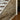Silvermyst planks on a wall beneath a staircase, next to a doorway