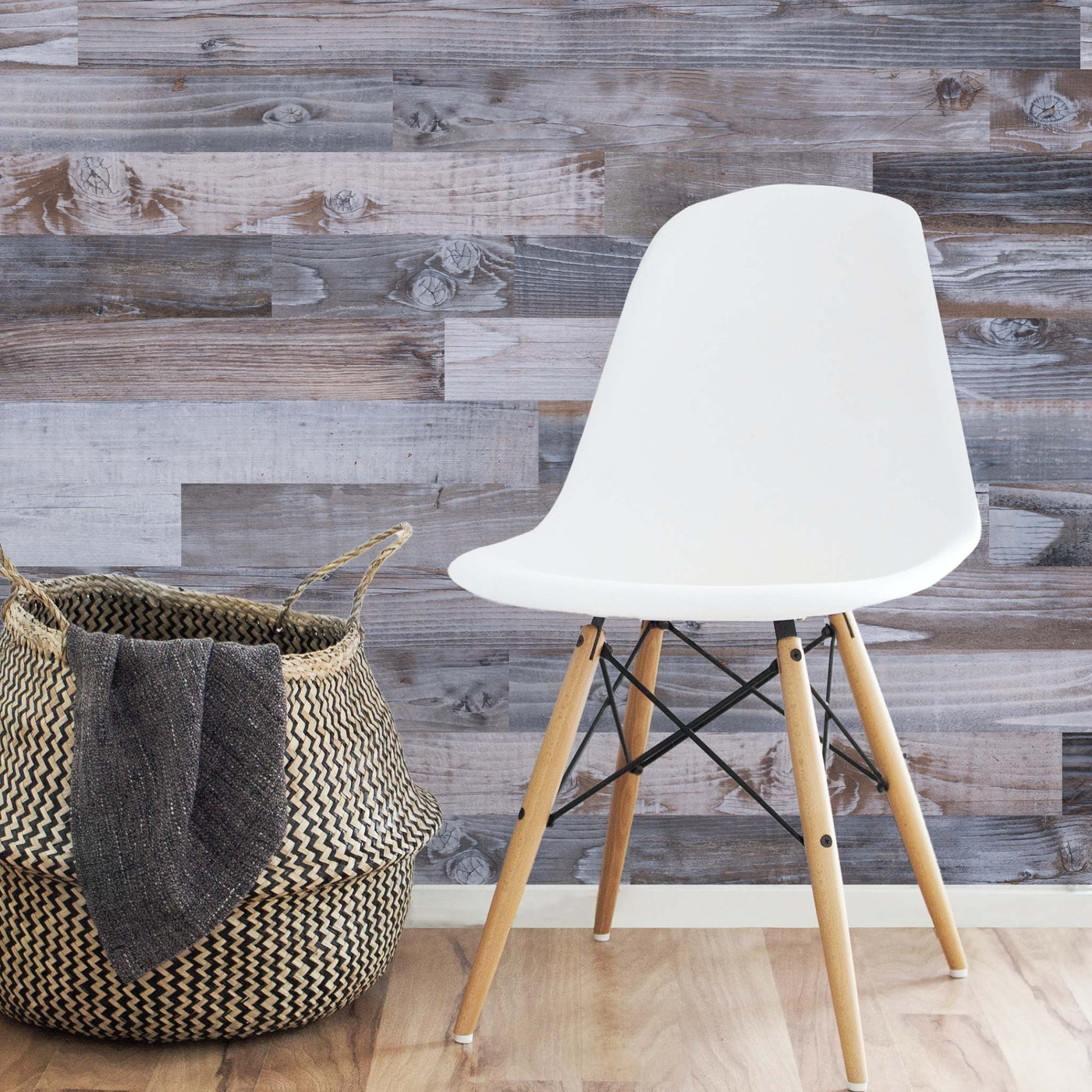 Steel Gray planks on a wall behind a white chair and woven basket