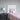 Twin bed with a white, horizontal plank headboard and pink bedding