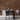 Dining room with Valley Fog Stikwood wall planks behind a table and chairs