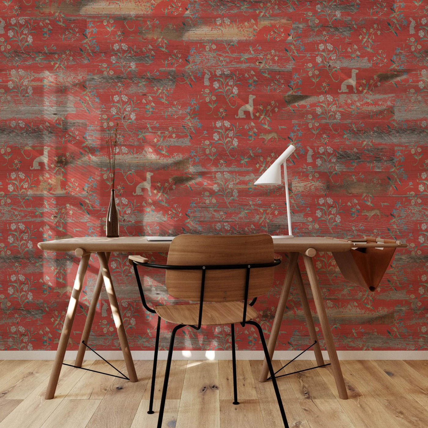 Desk and chair against a wall covered in red Tapestry planks