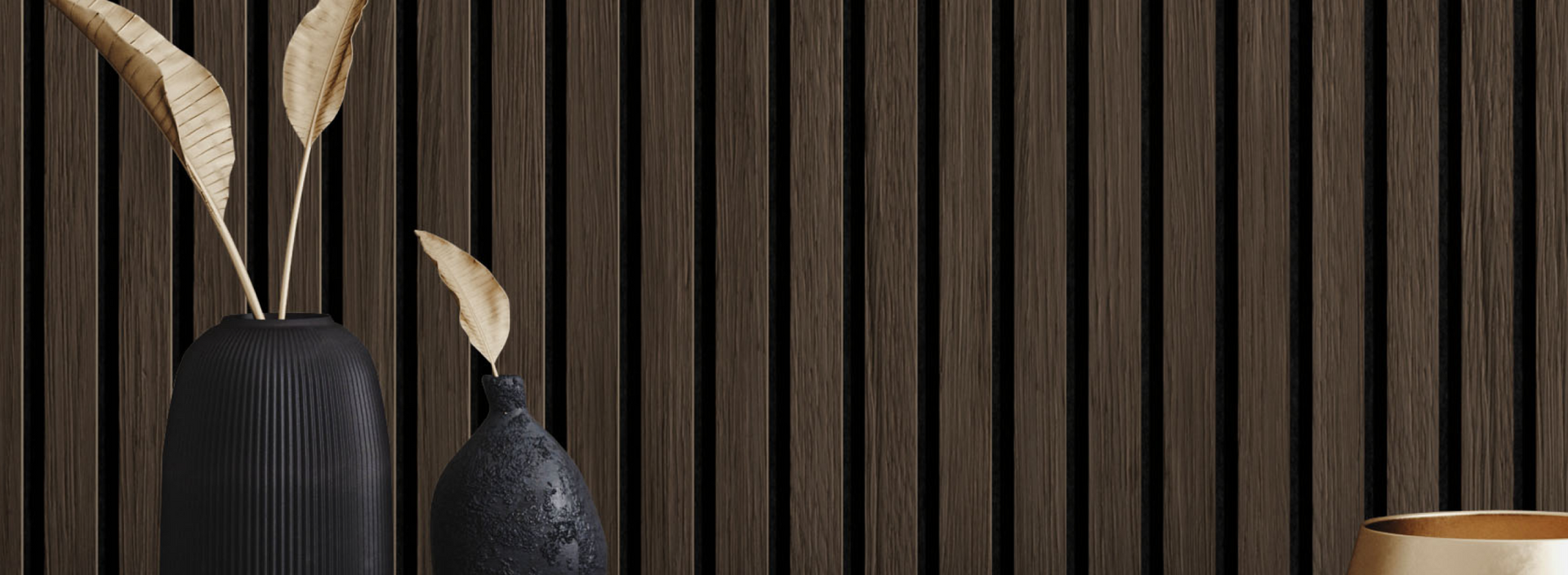 Dark natural wood plank accent wall with decorative black vases and dried leaves in a cozy room setting