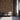Chevron Buckskin Mosaic Wood Wall Tiles behind three chairs in a waiting area