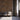 Stacked Buckskin Mosaic Wood Wall Tiles behind three chairs near an open door