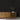 Wall covered in Grid Ember Mosaic Wood Tiles above a wood credenza