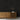 Black Stacked Ember mosaic wood tiles on a wall behind a wooden console table