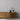 Herringbone Glacier Mosaic Wood Wall Tiles behind a wooden console table with vases