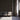 A wall clad in Cobblestone Gunstock Mosaic Wood Tiles behind three chairs
