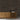 Stacked Gunstock Mosaic Wood Wall Tiles behind a wood credenza