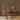 Desk and chair in front of a wall covered in Ashlar2 Buckskin mosaic wood tiles