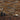 Brick Buckskin Mosaic Wood Wall Tiles as backdrop for vases and a bowl on a cabinet