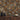 A wall covered in Grid Buckskin mosaic wood tiles above a wood cabinet