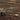 Stacked Buckskin Mosaic Wood Wall Tiles behind a dark wood cabinet