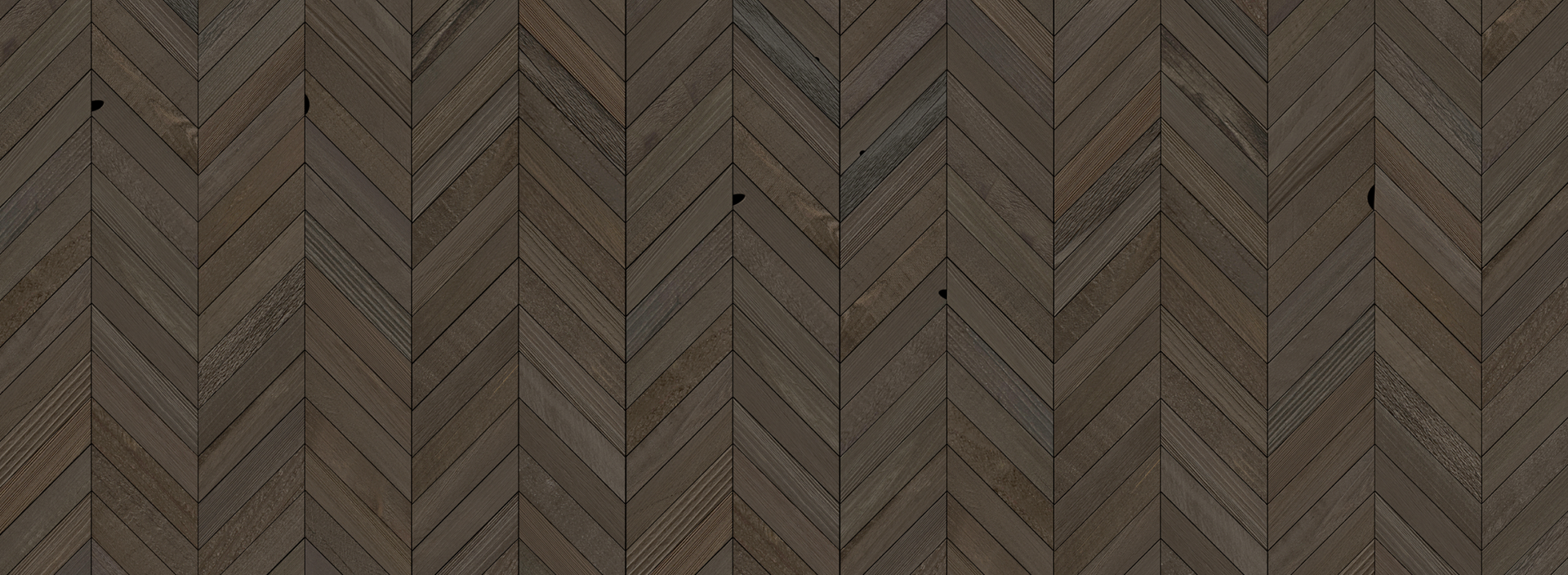 Dark natural wood plank wall with a herringbone pattern creating a rustic peel and stick accent wall effect