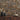 Ashlar1 Natural Mosaic Wood Wall Tiles as a backdrop for vases and a bowl on a wood cabinet