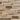 Varied natural wood planks in light and medium tones arranged in a staggered mosaic for a peel and stick accent wall