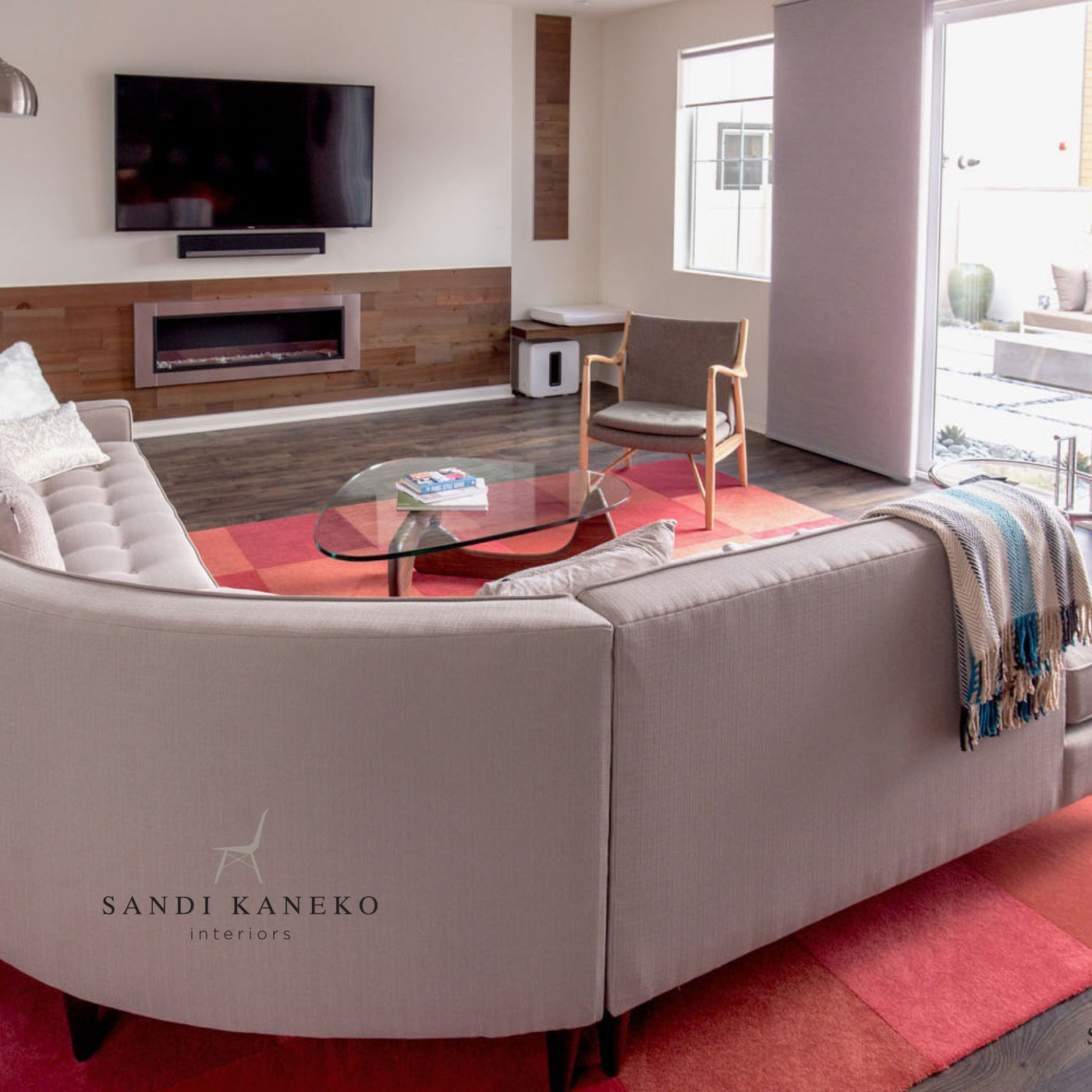 vandyke peel & stick wood planks surrounding gas fireplace insert in modern living room. Image copyright Sandi Kaneko Interiors—www.sandikanekointeriors.com